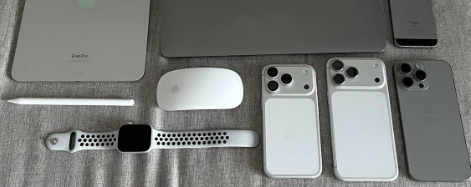 iPhone 17 Pro Max in multiple colors - graphite, silver, gold, deep blue, and sunset orange